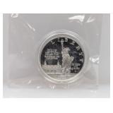 1986 90% Silv Ellis Isl Comm $1 Dollar