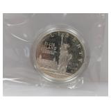 1986 90% Silv Ellis Isl Comm $1 Dollar