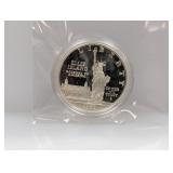 1986 90% Silv Ellis Isl Comm $1 Dollar