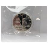 1986 90% Silv Ellis Isl Comm $1 Dollar