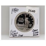 1986 90% Silv Ellis Isl Comm $1 Dollar