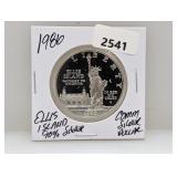 1986 90% Silv Ellis Isl Comm $1 Dollar