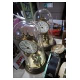 PAIR OF GLASS DOME ANNIVERSARY CLOCKS