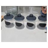 SET OF FOUR GLASS CANISTERS