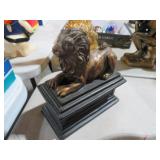 RESIN LION SITTING ON COLUMN