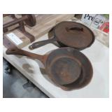 (2) CAST IRON SKILLETS , ONE HAS LID
