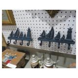 PAIR OF CAST IRON SAILBOAT LIGHTHOUSE HOOKS