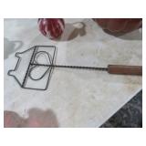 WROUGHT IRON HOUSE SHAPED RUG BEATER