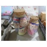 SET OF TWO GLASS JARS WITH PLUSH DOLL HEADS