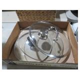 TWO GLASS POT LIDS WITH METAL HANDLES