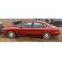 1999 red Ford Taurus se 97,292 miles ac and heat