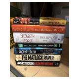 7 HARDBACK BOOKS. AUTHORS INCLUDE ROBERT LUDLUM