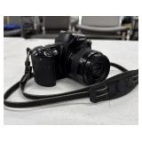 Canon EOS Rebel XS 35mm film SLR camera with a