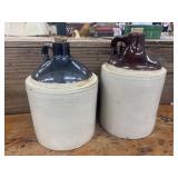 Stoneware whiskey jugs with a two-tone glaze.