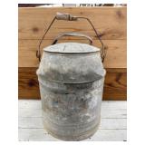Galvanized Water Jug with Handle. Some wood