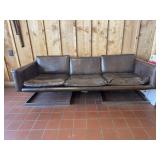 Vintage Mid Centry modern floating leather couch.