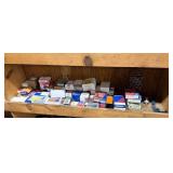 Shelf lot of u joints, idler pullies, and wheel