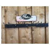 Metal vintage Gates Garage sign and coat rack.