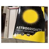 Large paper cutter and package of opened Astro