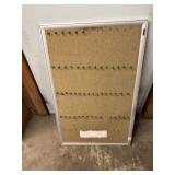 Pegboard with hooks used to hold keys