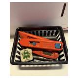 Basket with box cutters and a few other random