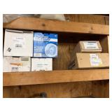 Shelf lot of blower motors and brackets