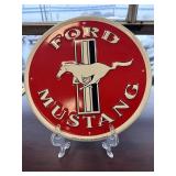 Round metal red Ford Mustang sign.