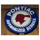 Round metal Pontiac Authorized Service sign.