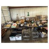 8 foot wooden table. Metal folding legs. Contents