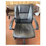 Rolling adjustable Leather office desk chair. Has