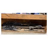 Shelf lot of jacks and tire irons