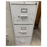 Three drawer metal filing cabinet. See photos for