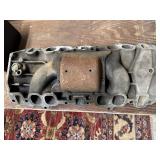Vintage cast iron Chevrolet V8 intake manifold.