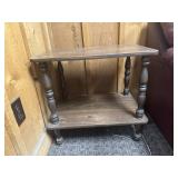 Wooden 2-tier side table with spindle legs.