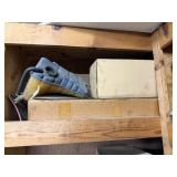 Shelf lot of water reserve jugs, auto parts