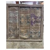 Handmade quilt in antique wooden window frame for