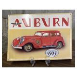 Vintage-style advertising sign for an Auburn