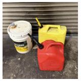 Lot of 2 gas cans and a can of transmission and
