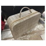 Vintage woven suitcase, likely made of wicker or