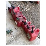 Bundle of 7 Red Plastic Gasoline Cans