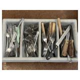 LARGE GRAY DIVIDED TRAY W/ FORKS AND STEAK KNIVES.