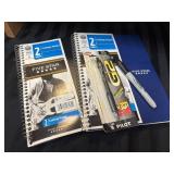 Two College Ruled NoteBooks, and one Sharpie and