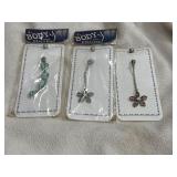 3 naval body piercing jewelry. Pink and blue