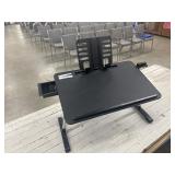 Adjustable laptop desk designed for use on a bed