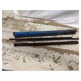 Hand tools, likely chisels or similar metalworking