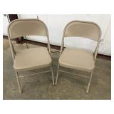 2 Tan Metal Folding Chairs