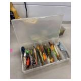 Various Lures, Hooks, and Weights In Clear Tackle