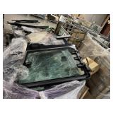 Bin full of track hoe doors and hardware