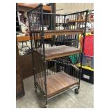 Vintage industrial style rolling cart, often