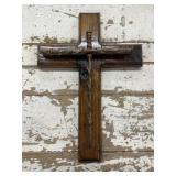 Handmade rustic wooden cross featuring barbed